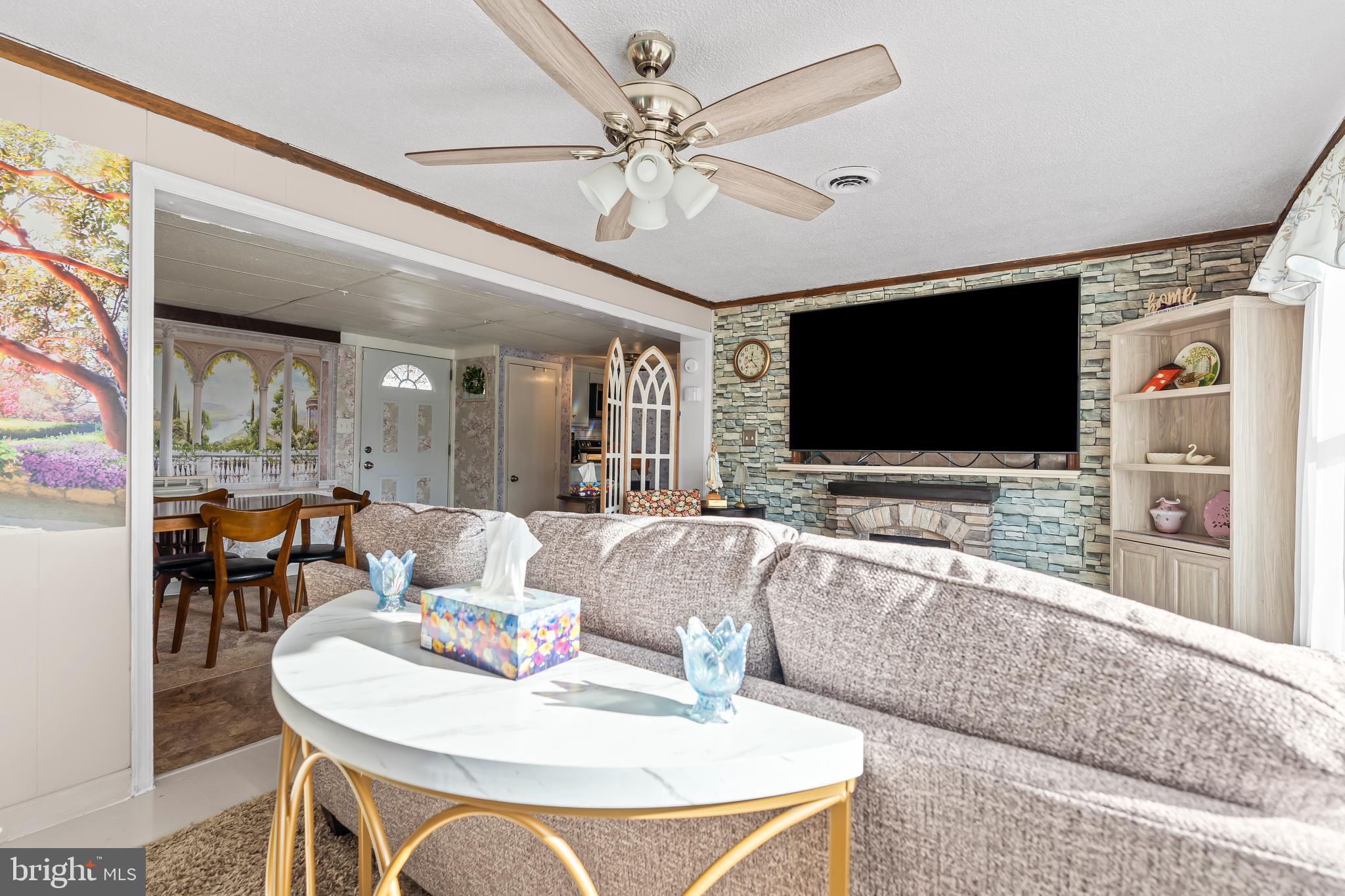 9437 Masters Road Waynesboro, PA 17268 - Photo 12 of 39 a living room with furniture and a flat screen tv