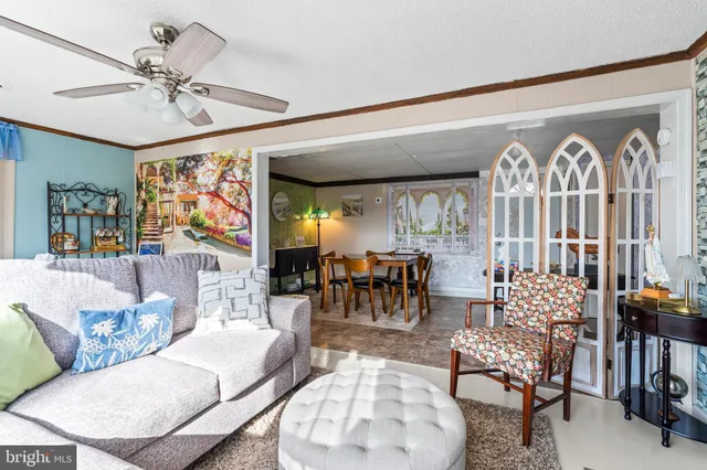 a view of a dining room with furniture and a table