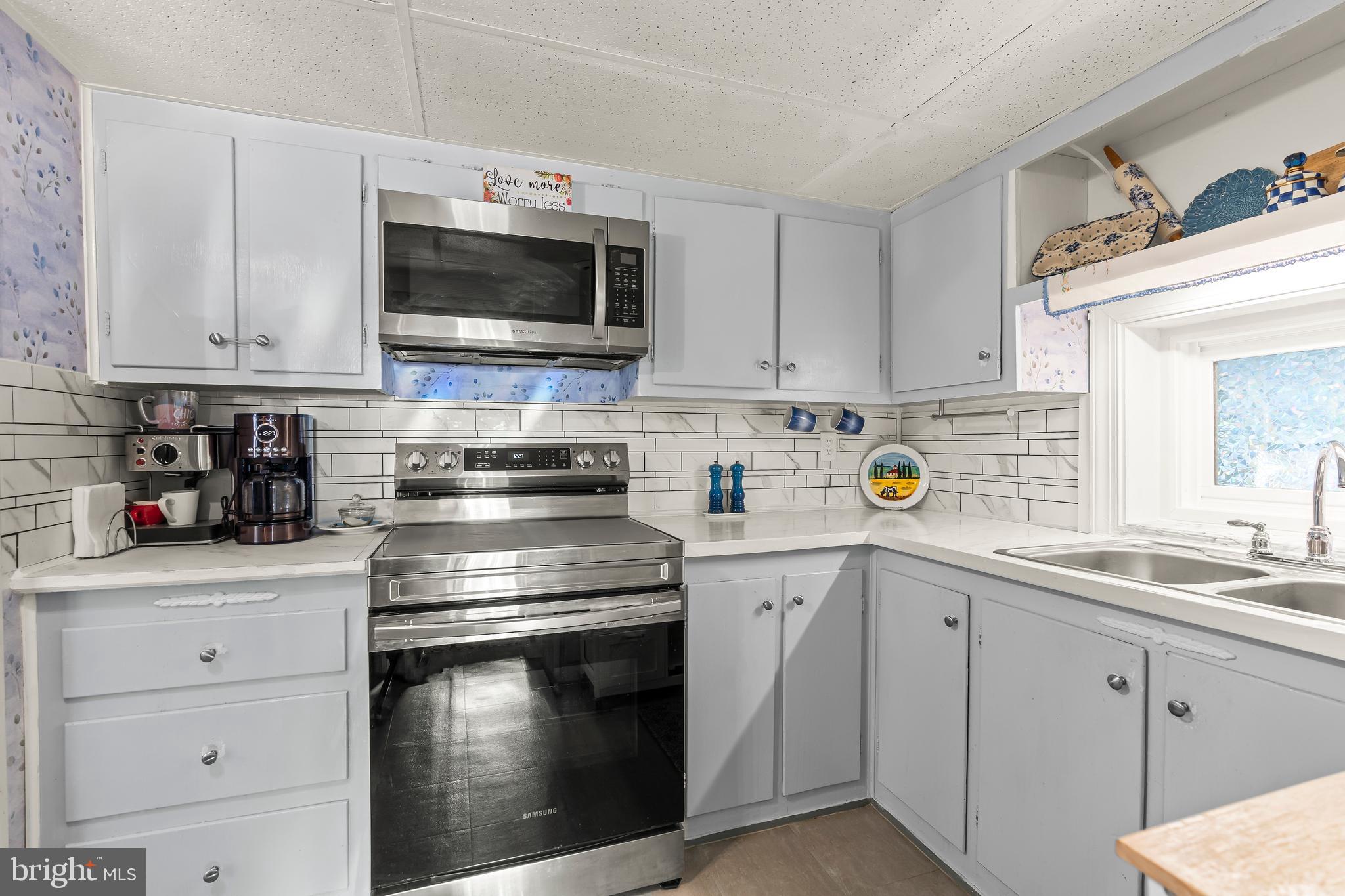 9437 Masters Road Waynesboro, PA 17268 - Photo 21 of 39 a kitchen with stainless steel appliances granite countertop a sink and a stove