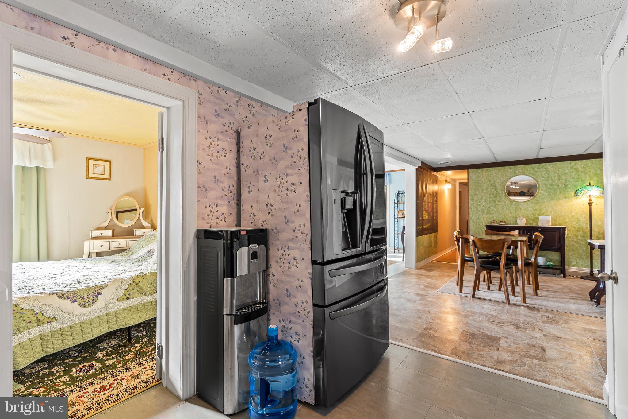 9437 Masters Road Waynesboro, PA 17268 - Photo 23 of 39 a kitchen with stainless steel appliances kitchen island granite countertop a refrigerator and a dining table