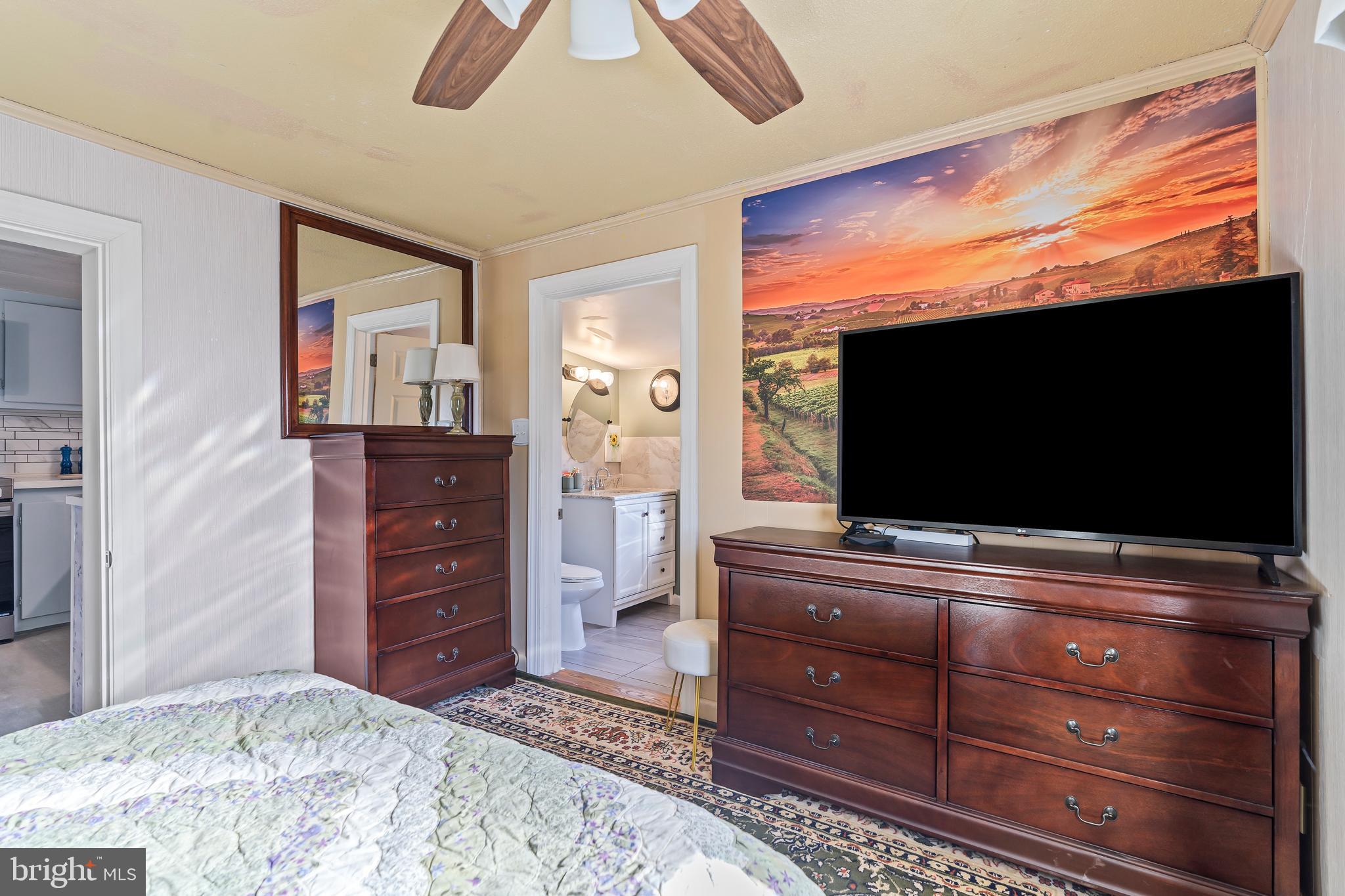 9437 Masters Road Waynesboro, PA 17268 - Photo 25 of 39 a living room with furniture and a flat screen tv