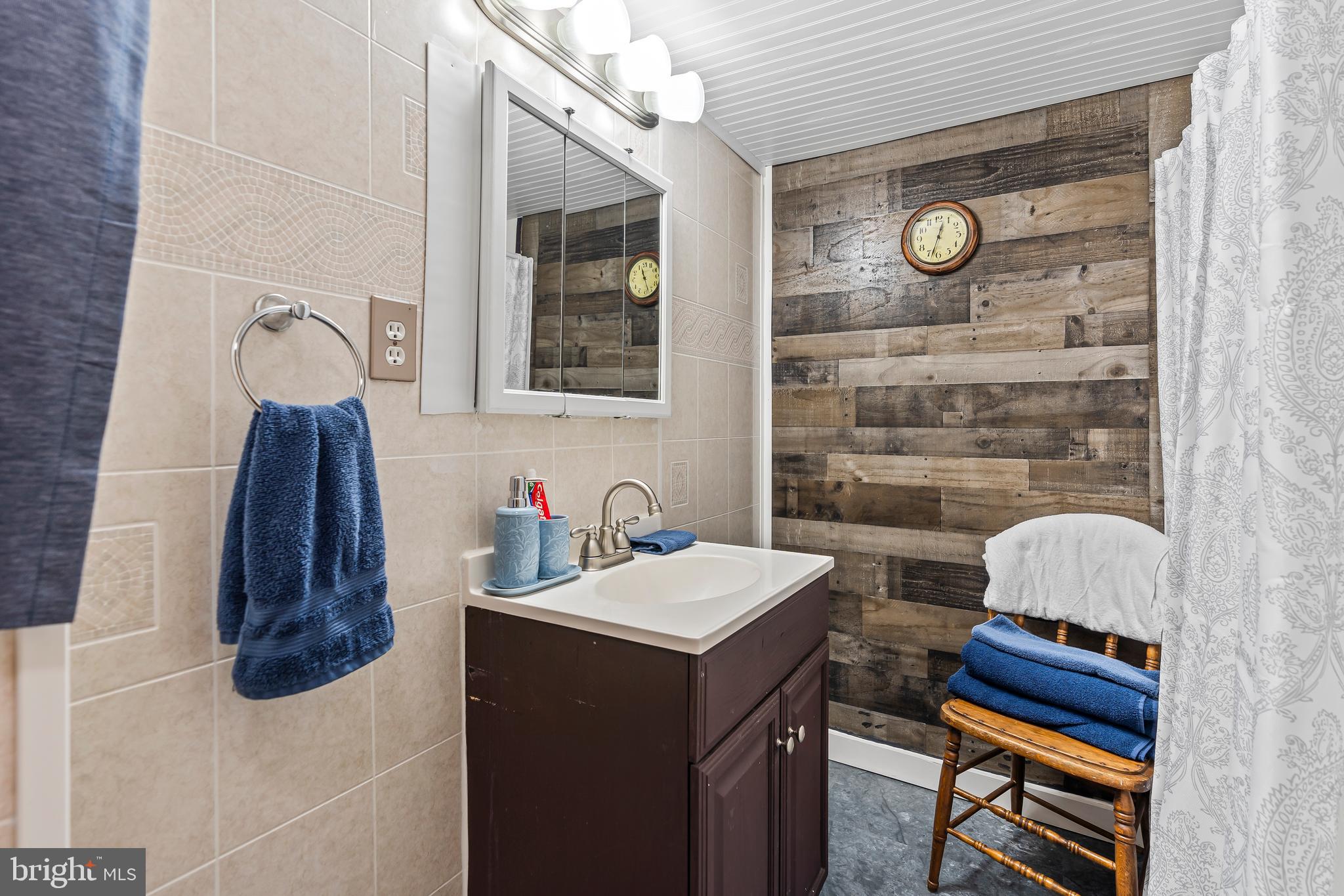 9437 Masters Road Waynesboro, PA 17268 - Photo 30 of 39 a bathroom with a sink and a mirror