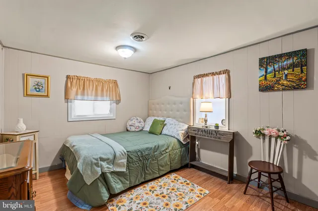 a bedroom with furniture and a window