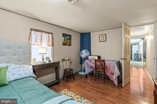 a view of a house with swimming pool and sitting area