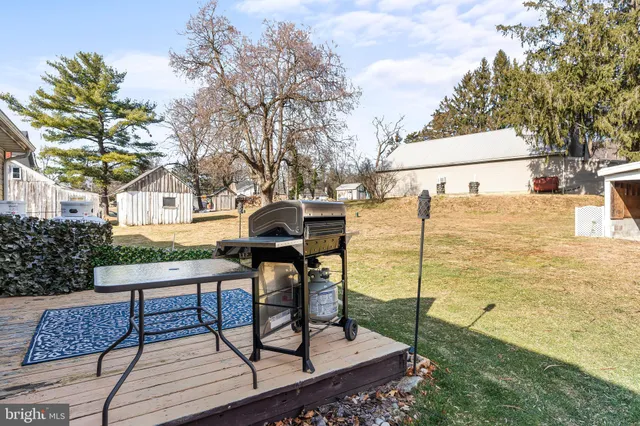 a view of a chairs and table on the deck