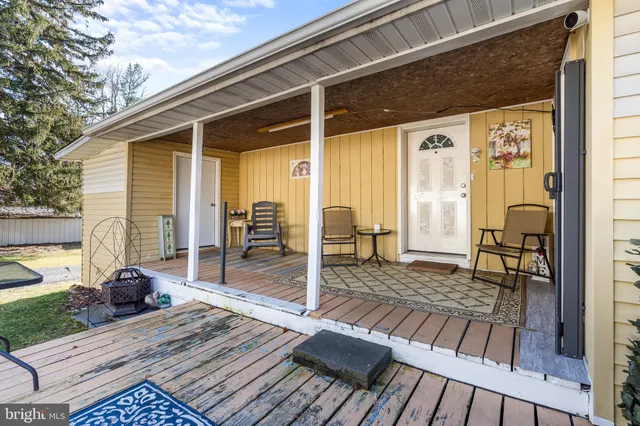 a view of a balcony with wooden floor