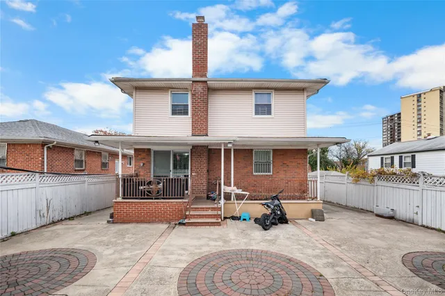 a view of a patio with a table and chairs