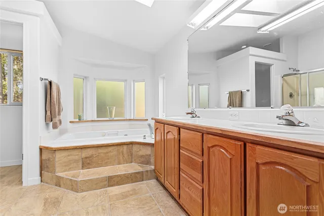 a bathroom with a bathtub and a sink