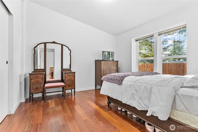 a bathroom with a sink a toilet and a shower curtain