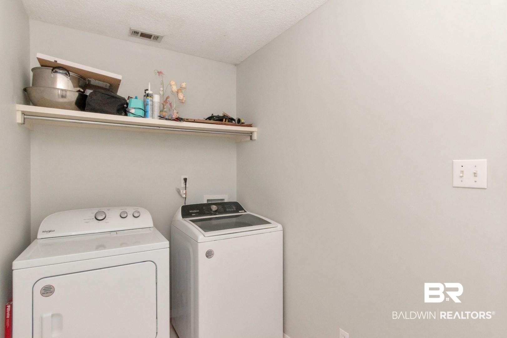 9991 Wedgefield Court Mobile, AL 36608 - Photo 23 of 30 Clothes washing area featuring washer and dryer and a textured ceiling