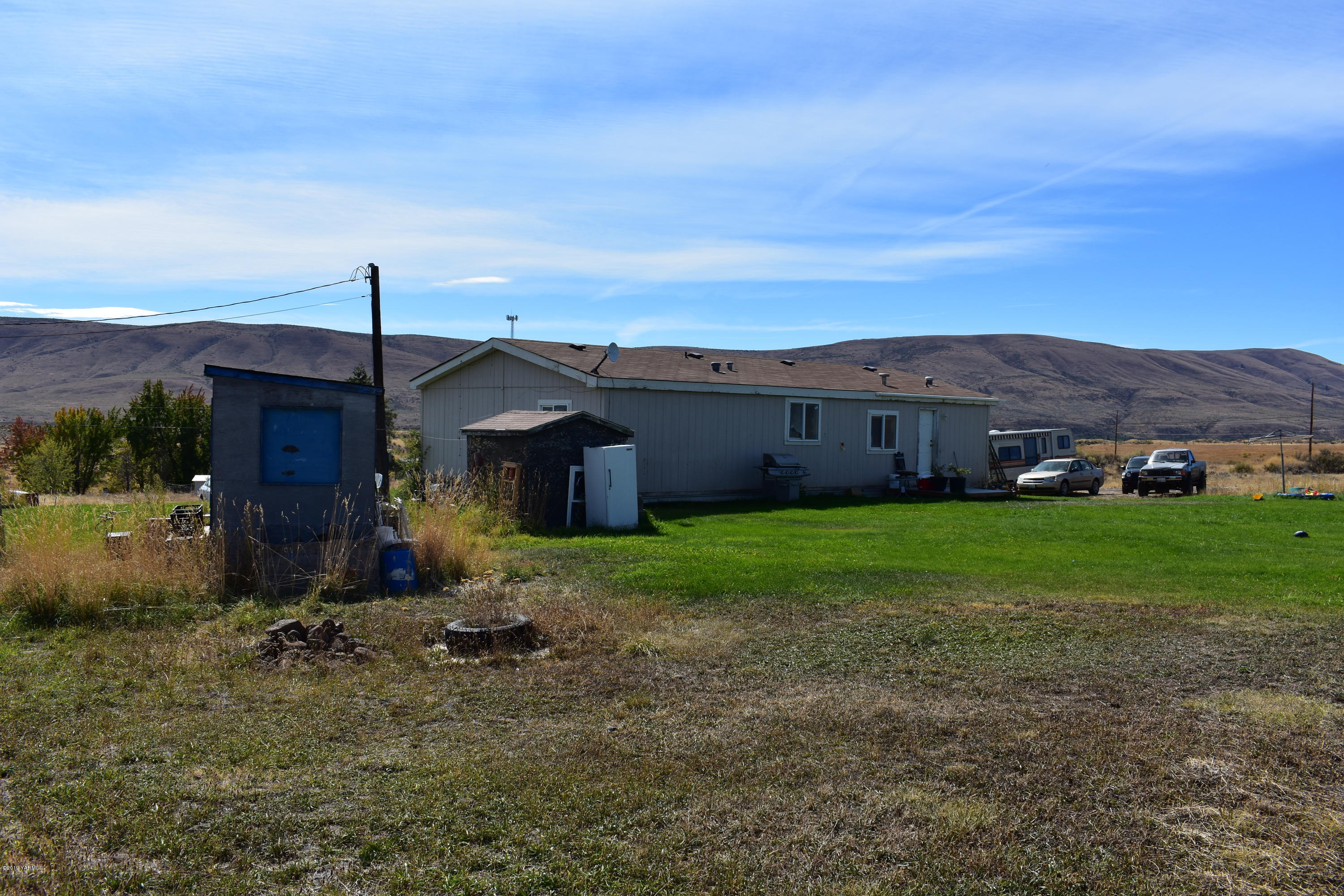 131 Mini Pines Road Yakima, WA 98903 - Photo 20 of 27 a view of a house with a yard