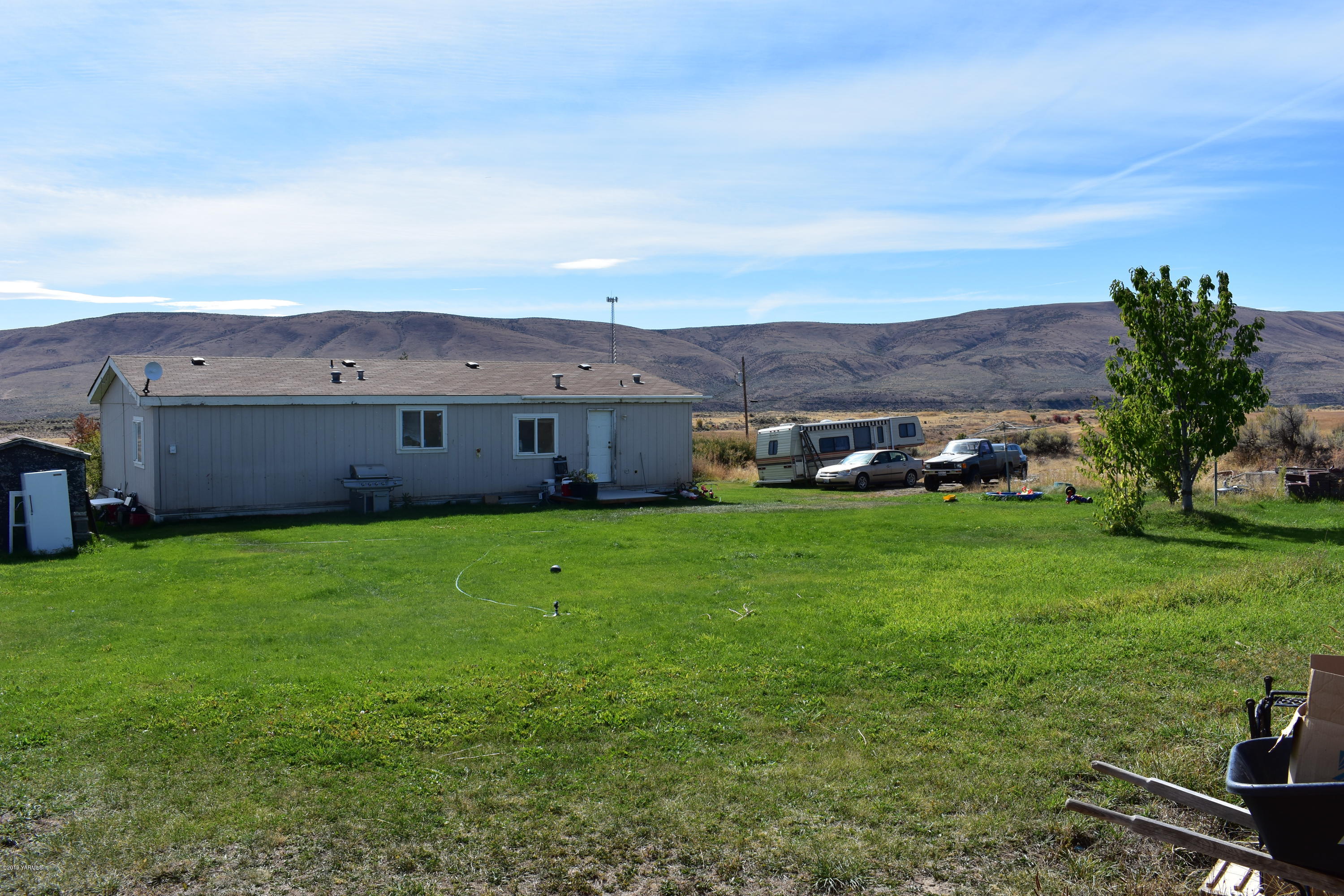 131 Mini Pines Road Yakima, WA 98903 - Photo 5 of 27 a view of a house with a big yard