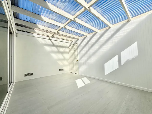 a view of empty room with windows