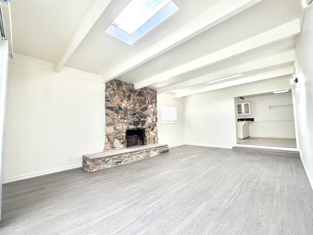 a view of fireplace and wooden floor
