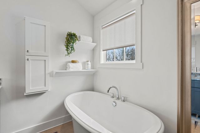 a bathroom with a sink and a window