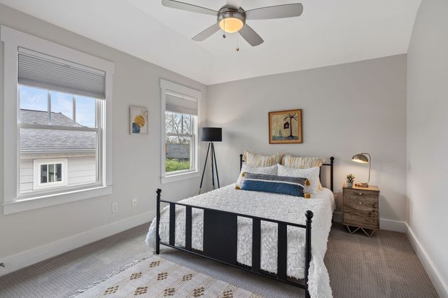 a bedroom with furniture and a window