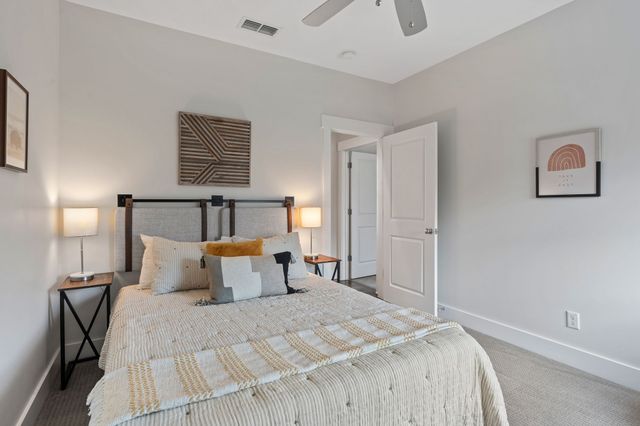 a bedroom with a bed and window