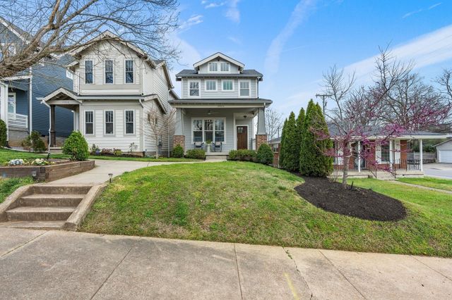 a view of a brick building next to a yard