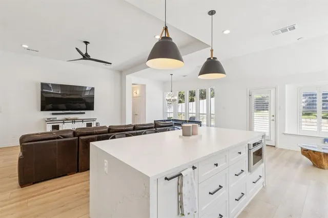 a view of a house with a yard and sitting area