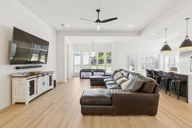 a living room with furniture fireplace and flat screen tv
