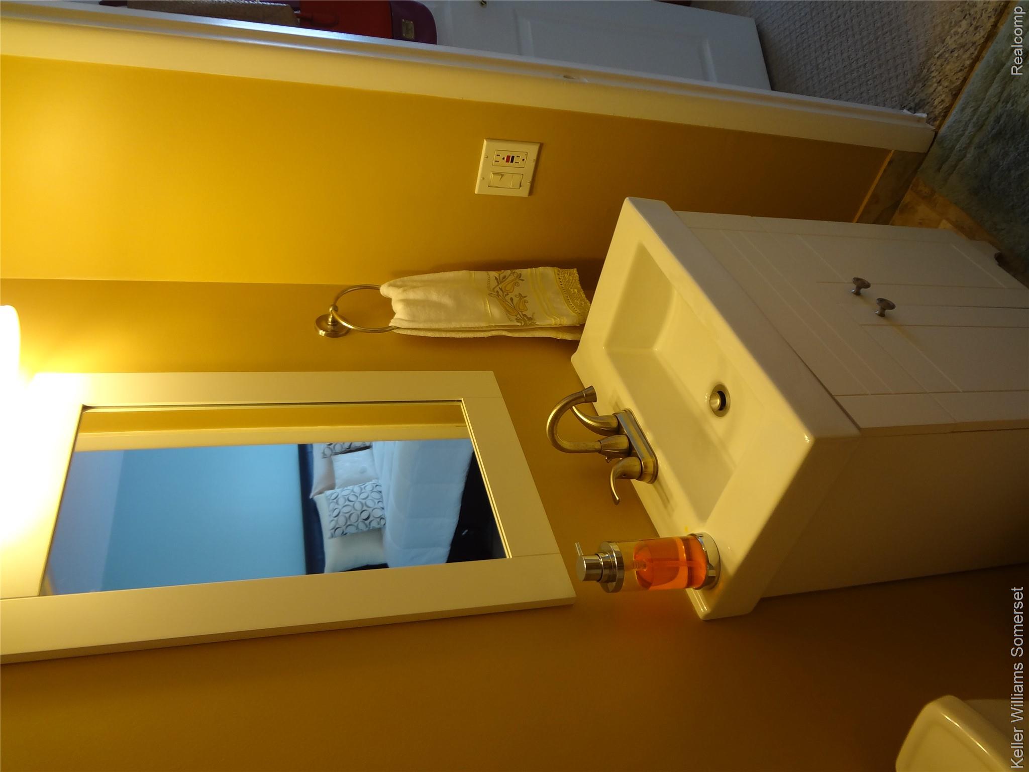 29626 Hoover Road, Unit 626 Warren, MI 48093 - Photo 21 of 35 Half bathroom with vanity and connected bathroom