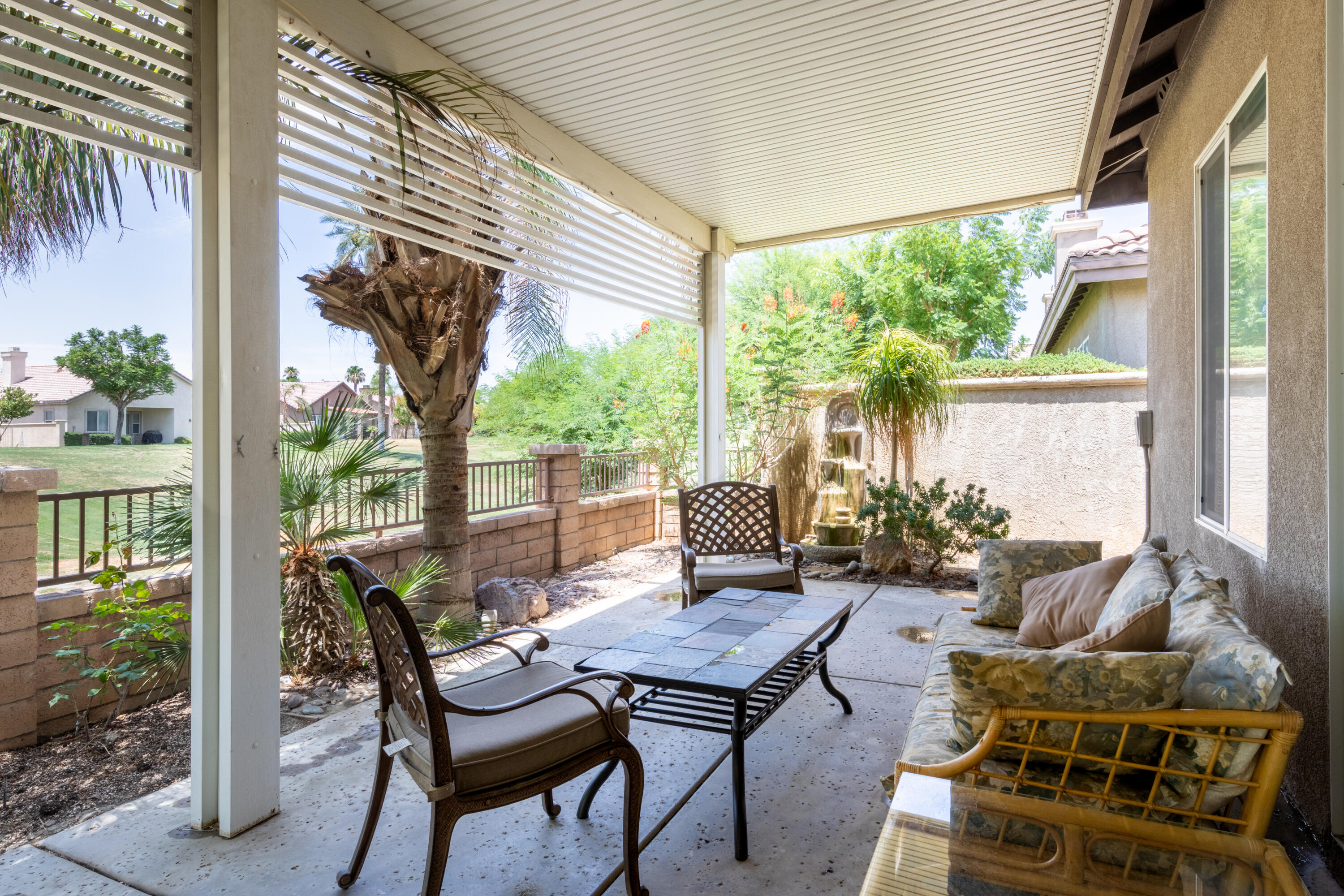 49475 Redford Way Indio, CA 92201 - Photo 15 of 45 a outdoor living space with furniture and garden view