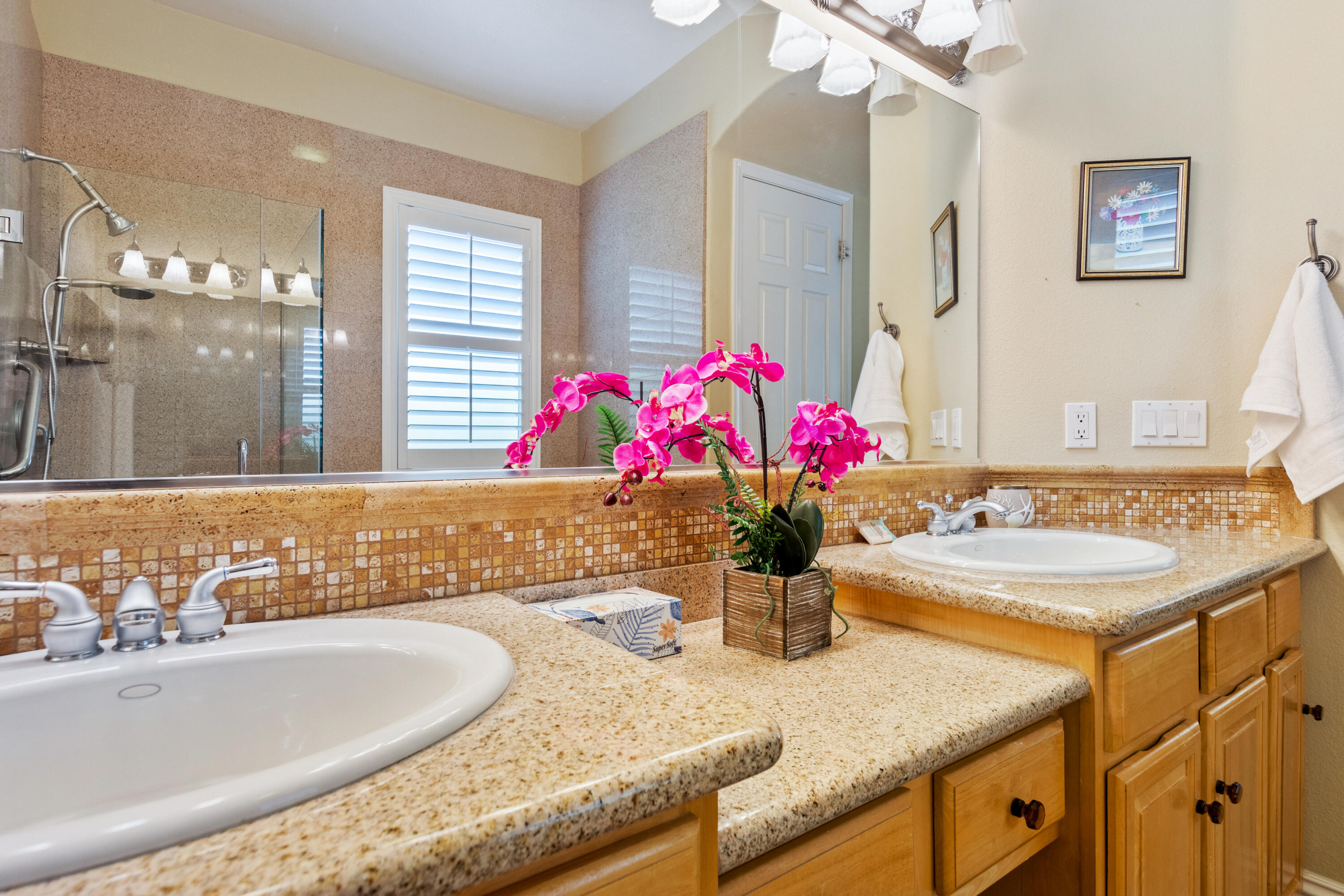 49475 Redford Way Indio, CA 92201 - Photo 16 of 45 a bathroom with a granite countertop sink and a mirror