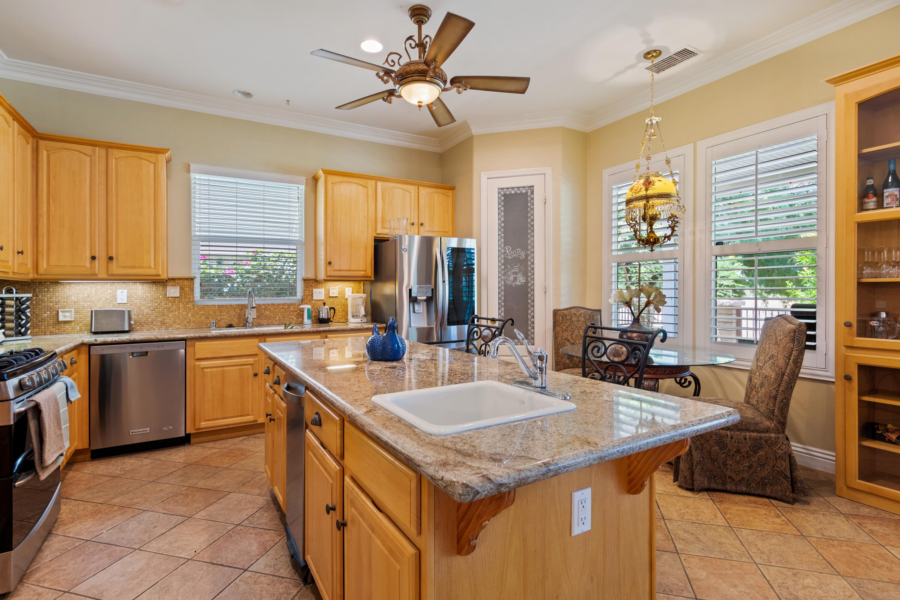 49475 Redford Way Indio, CA 92201 - Photo 29 of 45 a kitchen with a stove sink and cabinets