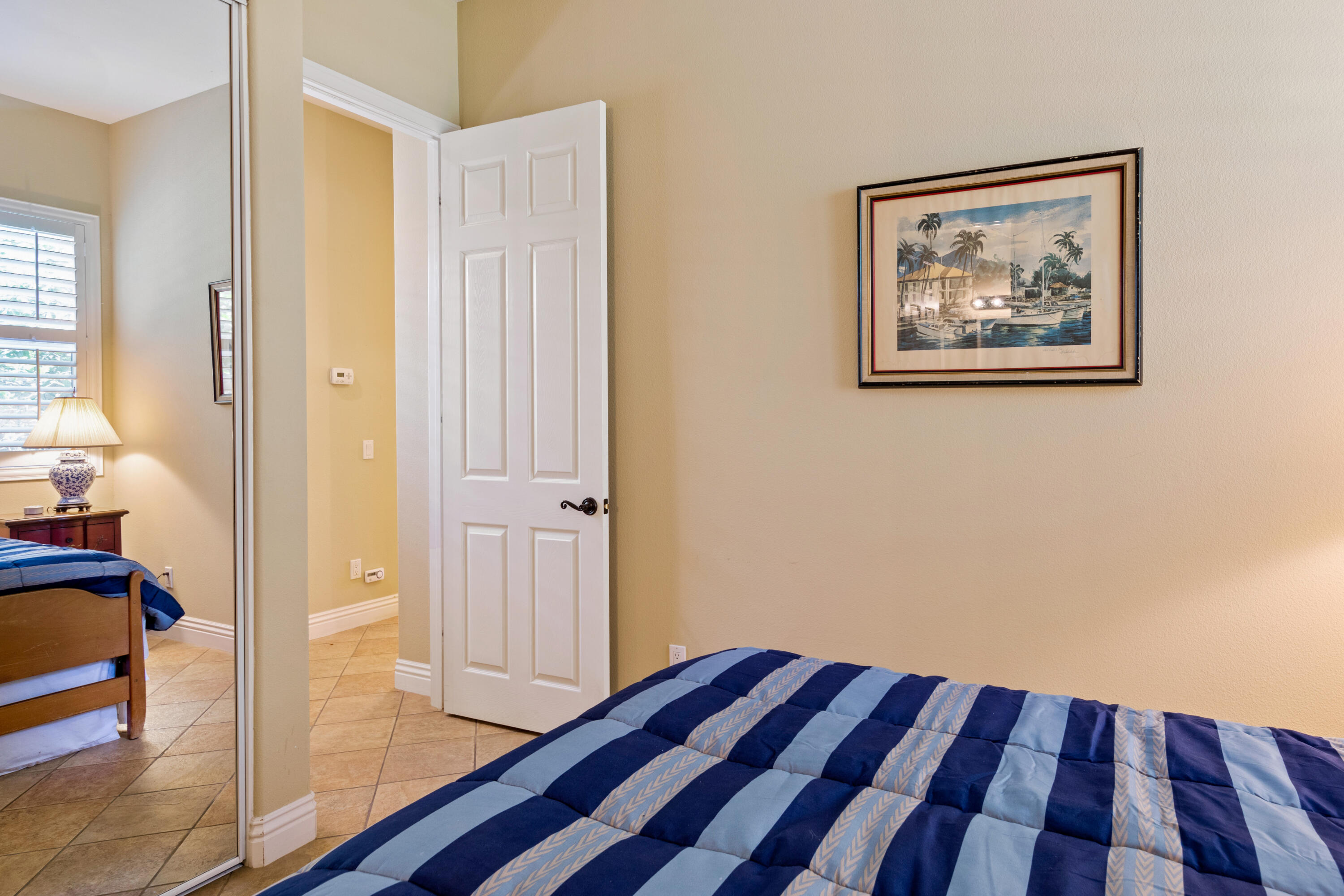 49475 Redford Way Indio, CA 92201 - Photo 39 of 45 a view of a hallway with wooden floor and a bedroom