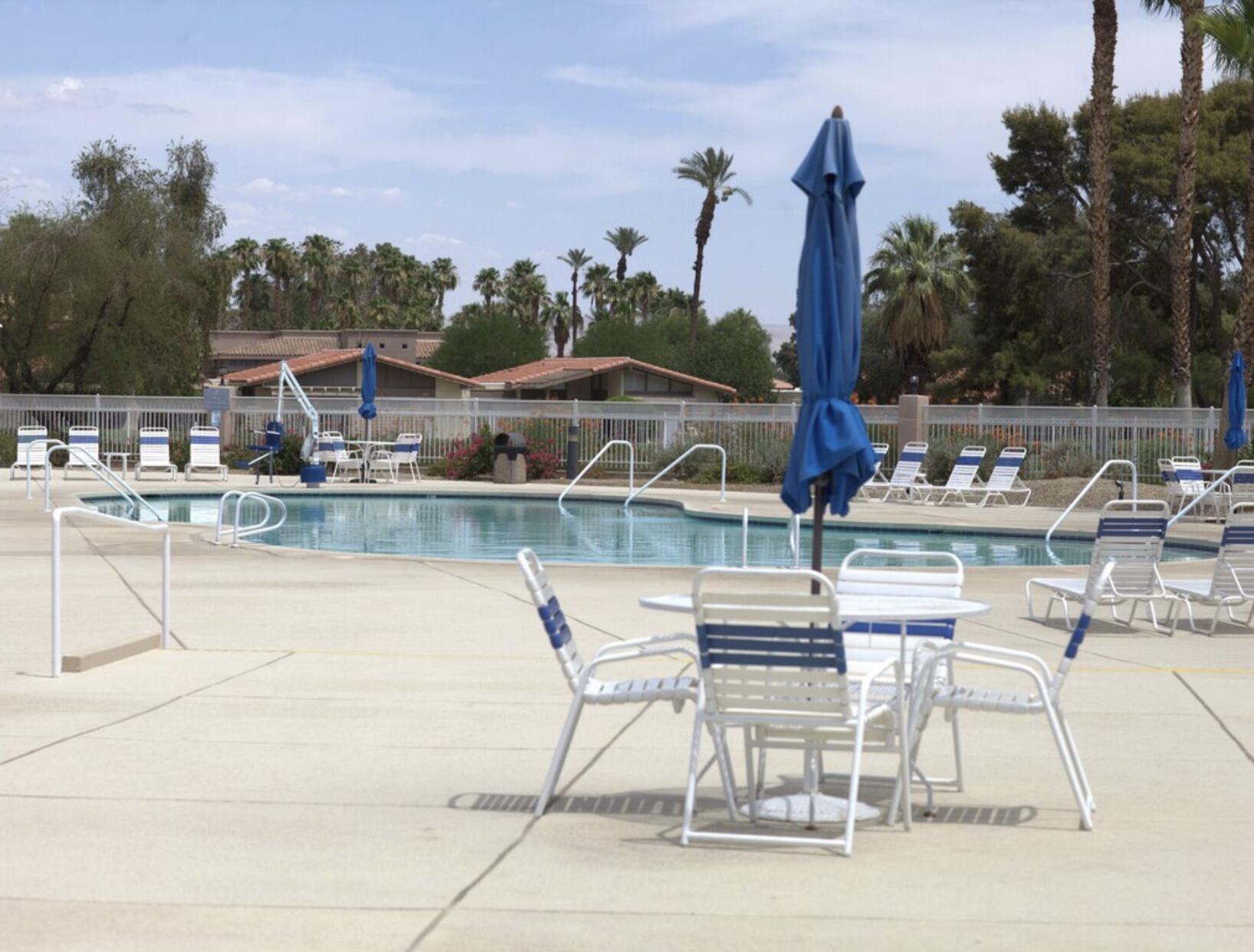 49475 Redford Way Indio, CA 92201 - Photo 4 of 45 a view of a lake with a table and chairs