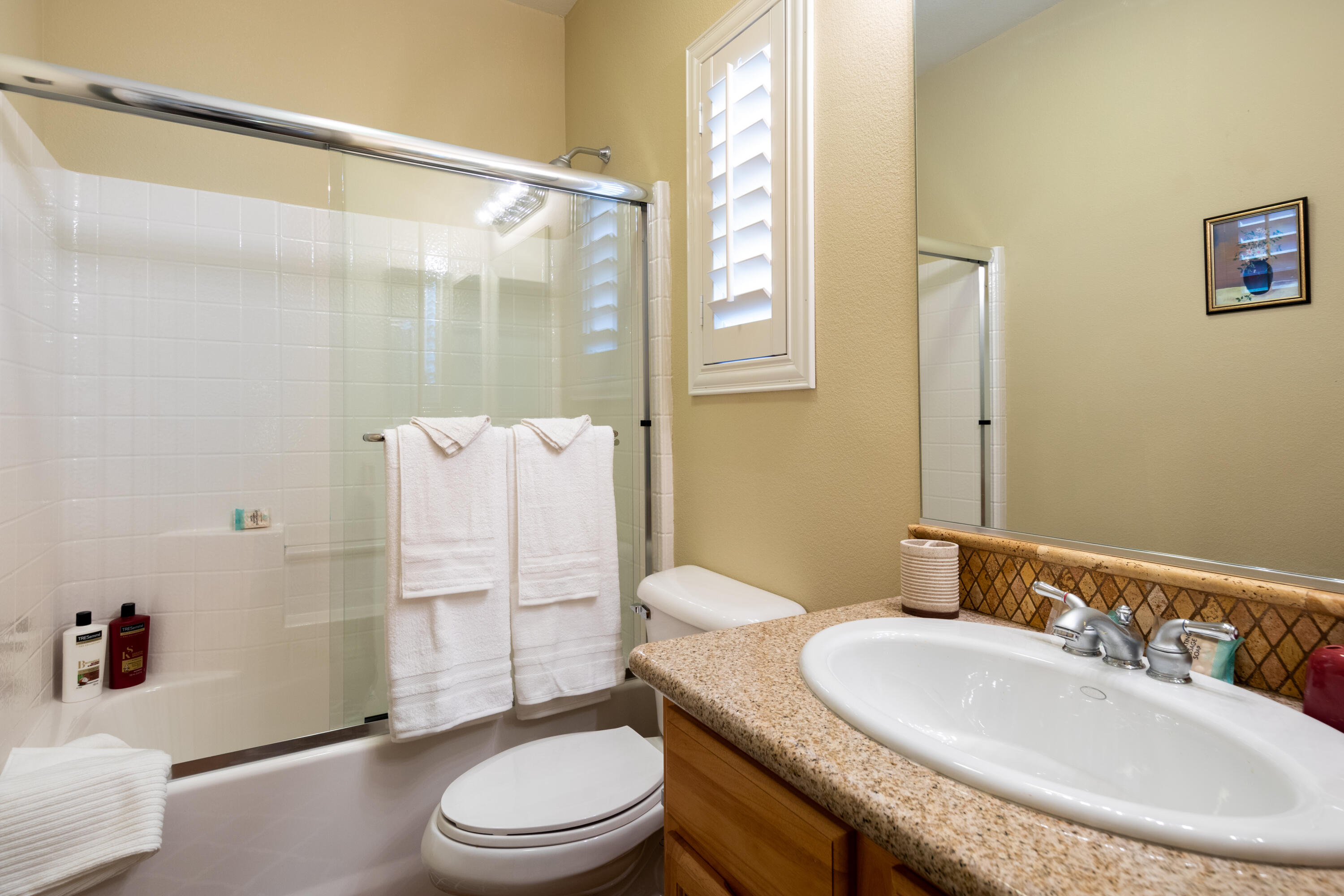 49475 Redford Way Indio, CA 92201 - Photo 43 of 45 a bathroom with a sink toilet and shower