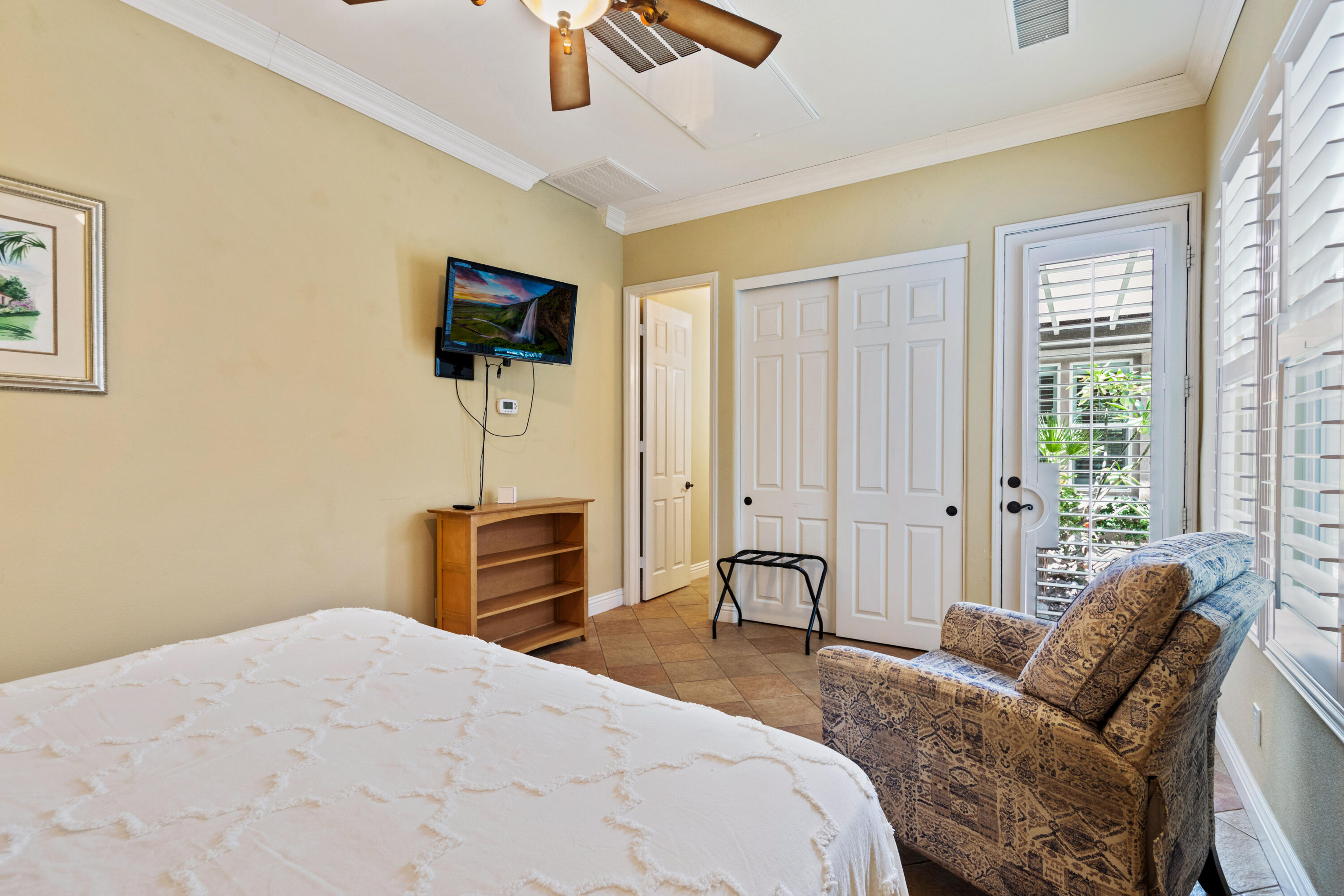 49475 Redford Way Indio, CA 92201 - Photo 45 of 45 a bedroom with a bed and a chandelier