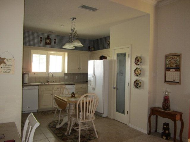 8613 Rochester Avenue Lubbock, TX 79424 - Photo 3 of 6 a dining room with furniture and window