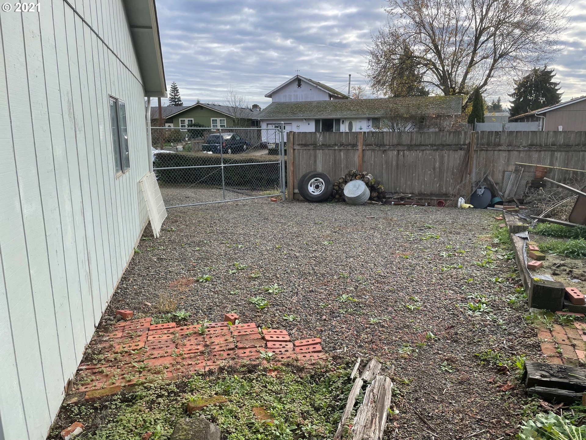 516 53rd Street Springfield, OR 97478 - Photo 11 of 13 a view of a backyard with a car parked in it