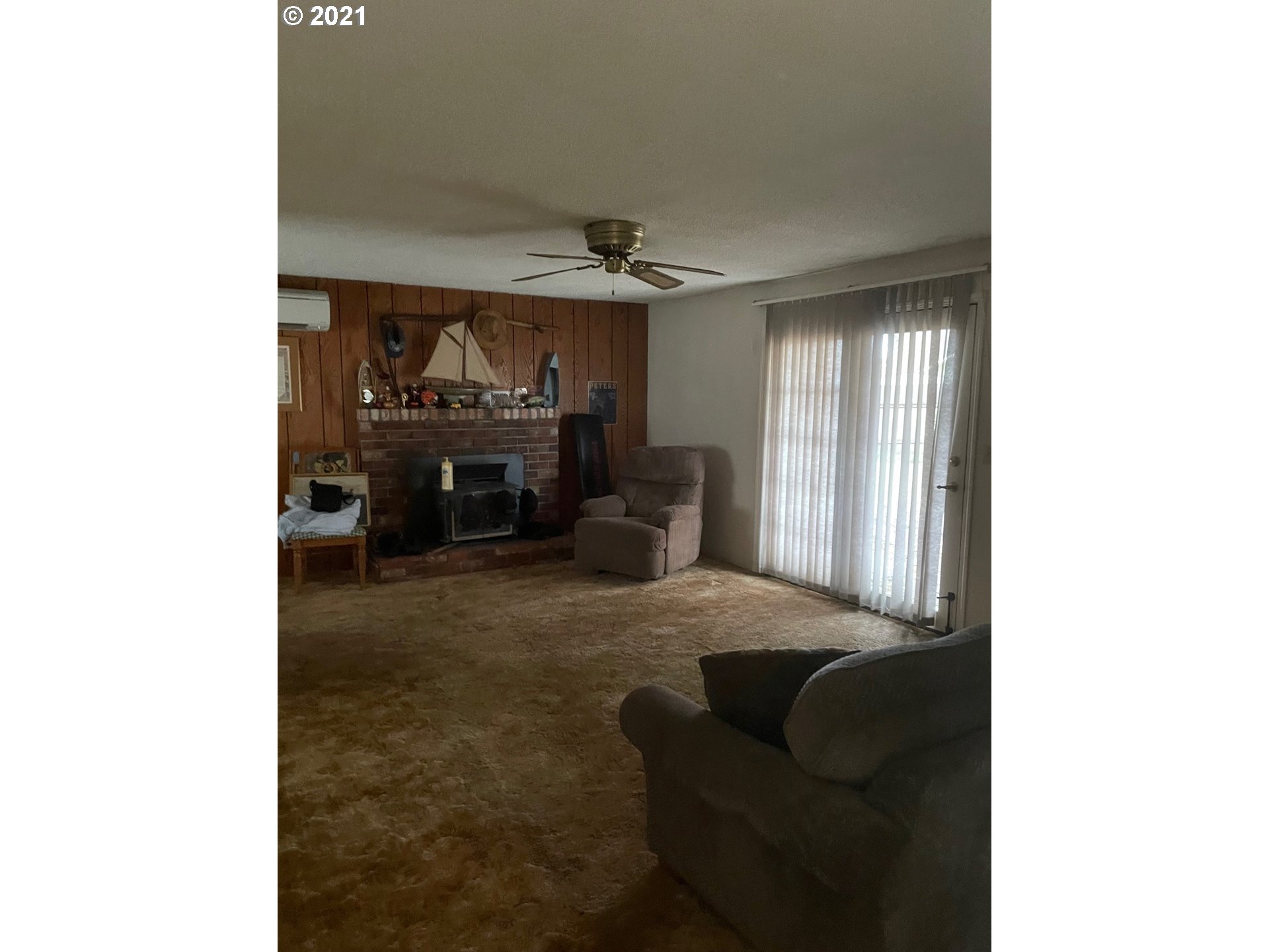 516 53rd Street Springfield, OR 97478 - Photo 3 of 13 a living room with furniture and a fireplace