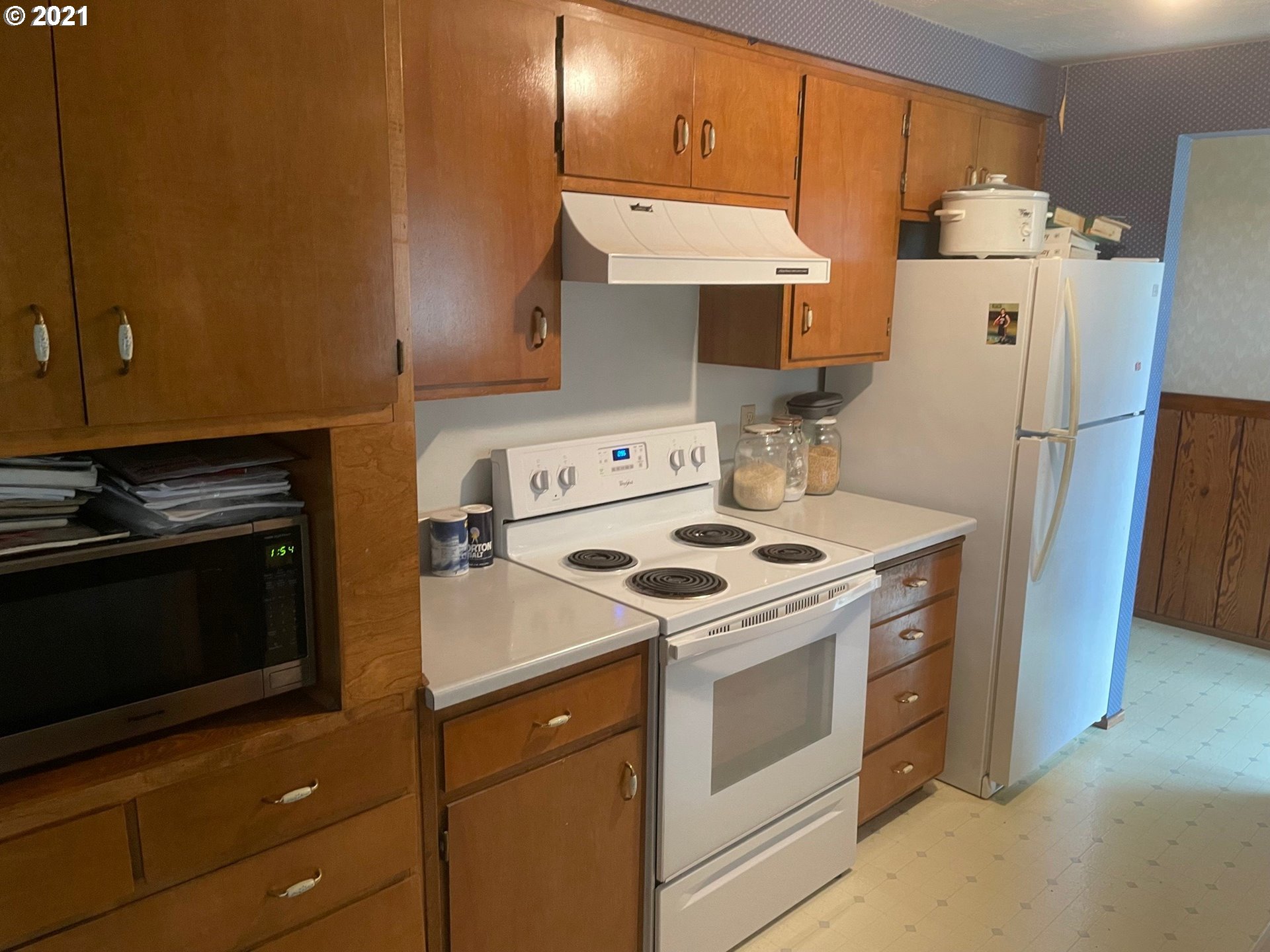 516 53rd Street Springfield, OR 97478 - Photo 5 of 13 a kitchen with a stove and a refrigerator