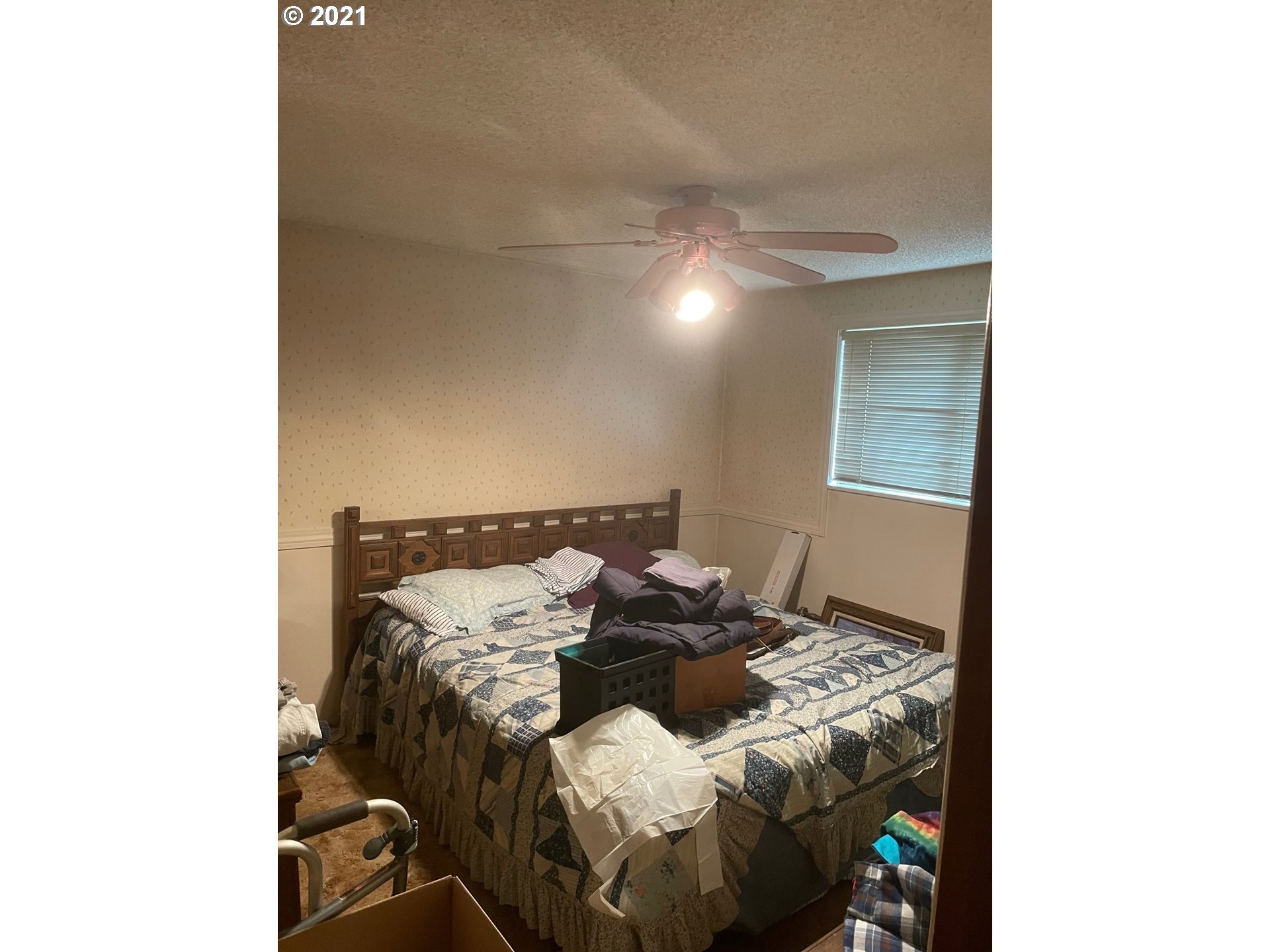 516 53rd Street Springfield, OR 97478 - Photo 6 of 13 a bed sitting in a bedroom next to a window