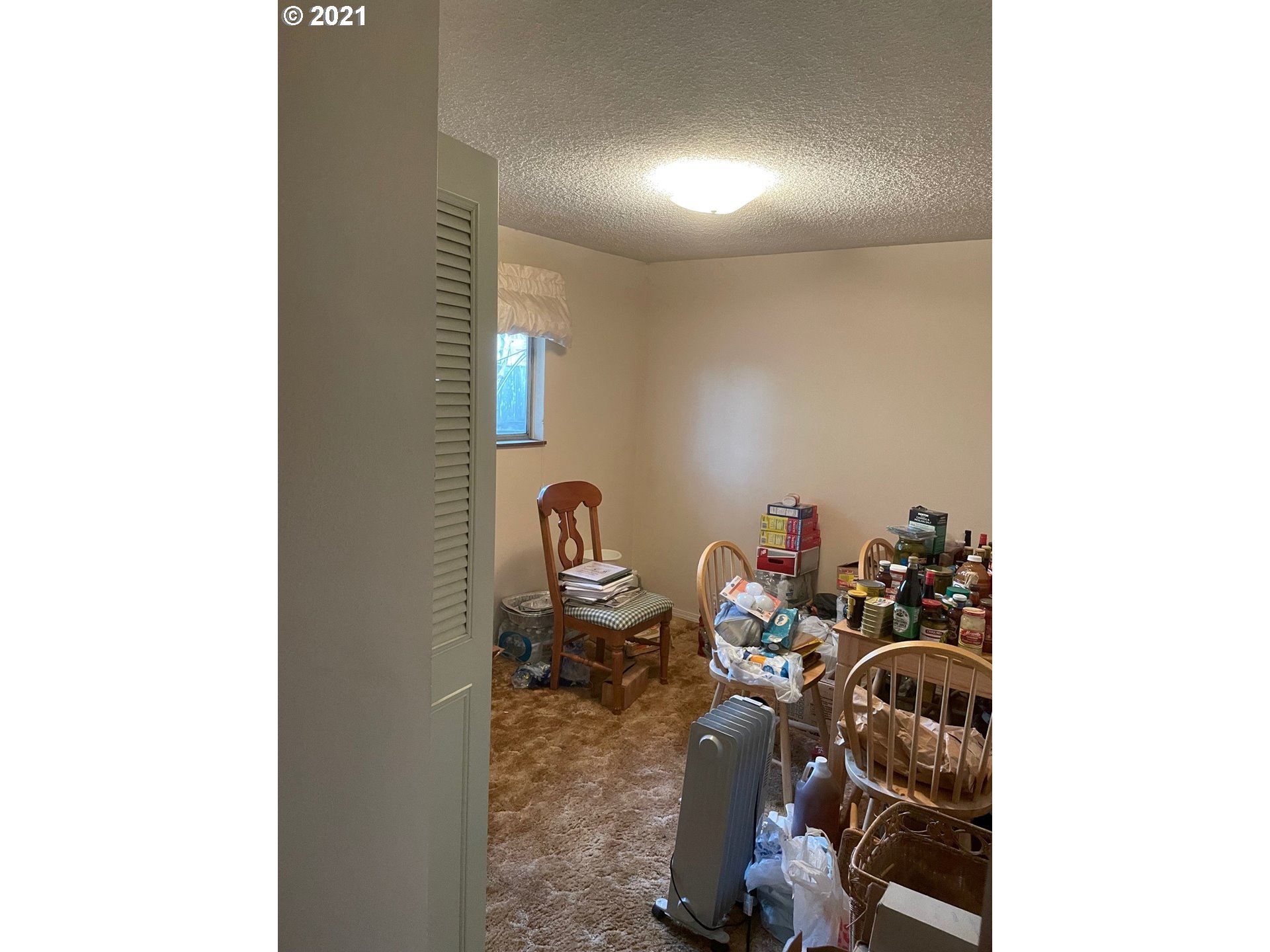 516 53rd Street Springfield, OR 97478 - Photo 7 of 13 a view of a room with storage and utility