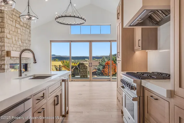 a view of a brick house with many windows