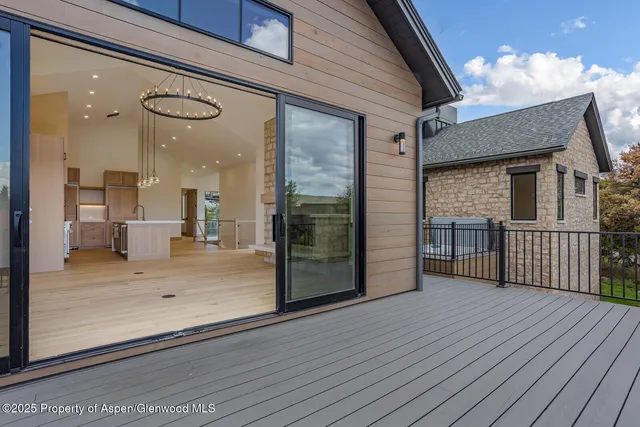 a view of balcony with wooden floor