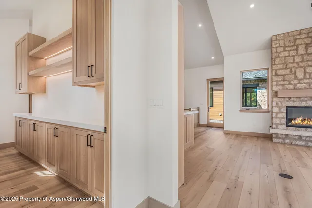a view of an empty room with closet and a window