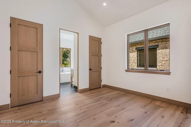 a bathroom with a sink and a large window
