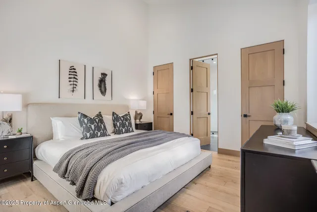 a view of a small space with wooden floor and a window