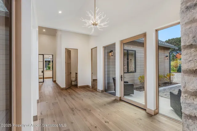 a spacious bathroom with a double vanity sink mirror and bathtub
