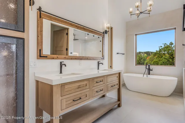 a living room with furniture and a painting