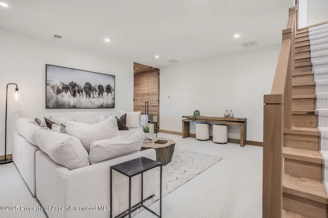 a view of a pathway of a house with wooden floor