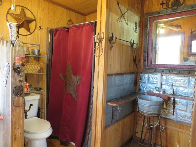 a dining room with furniture and a window