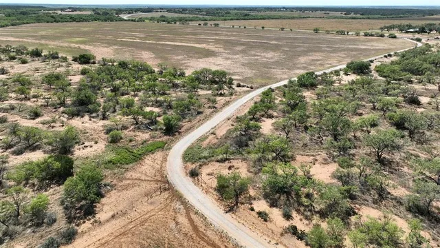 a view of a swimming pool and a yard