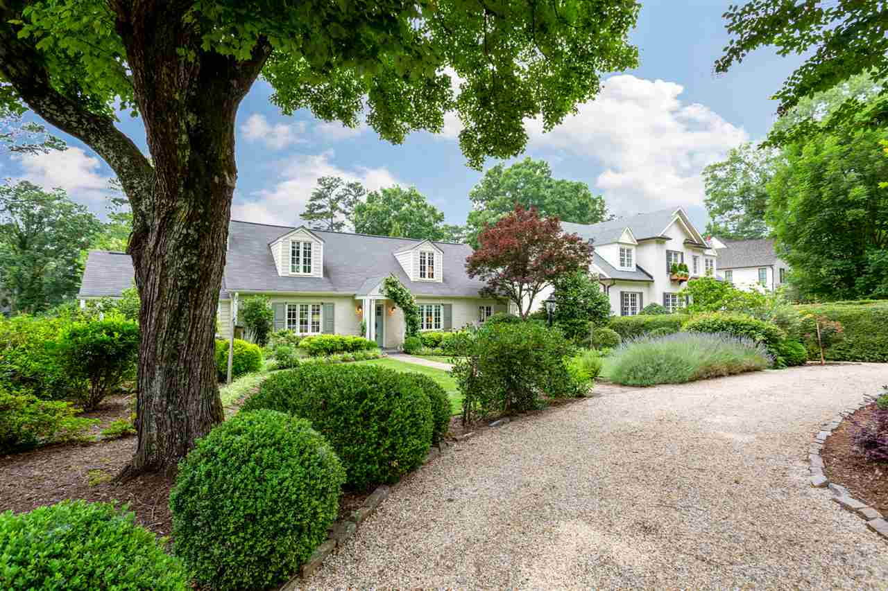 1321 Brooks Avenue Raleigh, NC 27607 - Photo 1 of 30 Practical circular drive in addition to a 2-Car Garage! The pea gravel drive with granite borders blends perfectly with the surrounding landscape. Front street view
