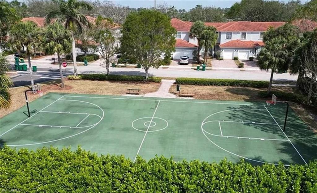 14712 Sutherland Avenue Naples, FL 34119 - Photo 6 of 8 an aerial view of a house with a swimming pool